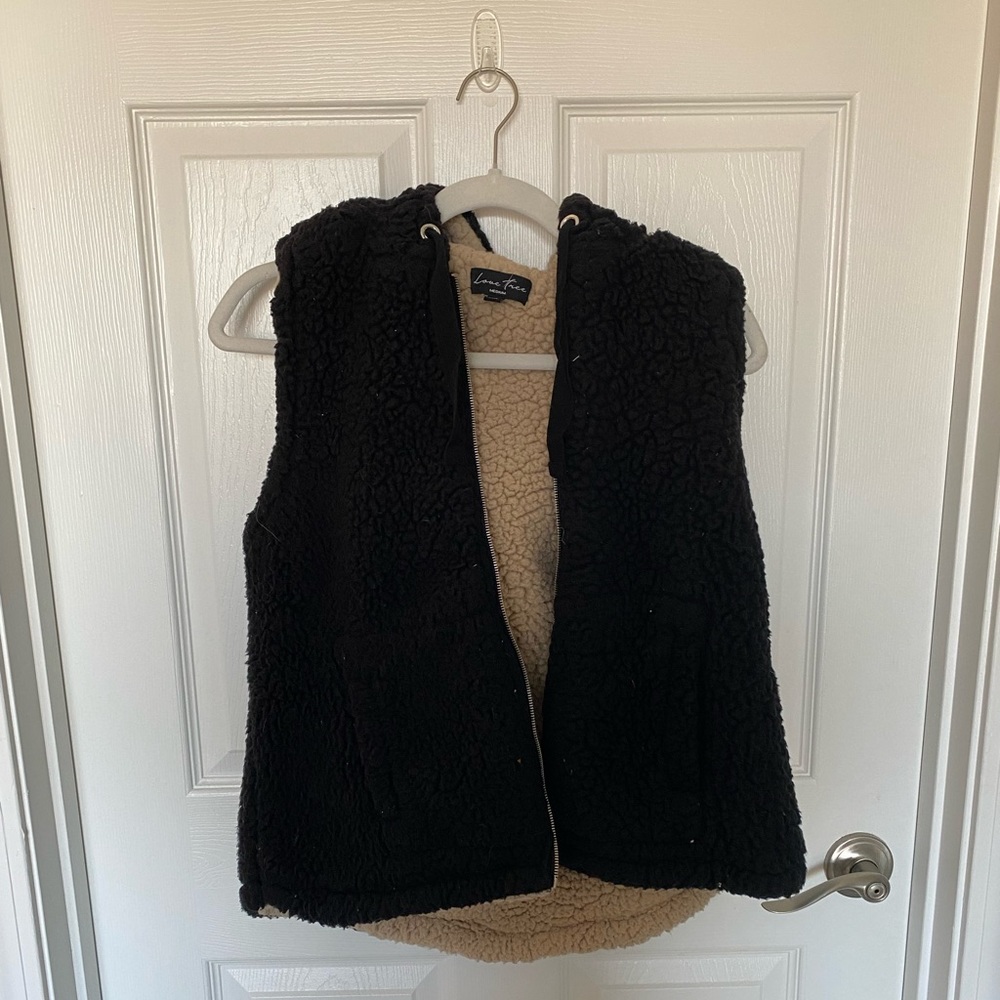 Puffy black vest. Size medium.